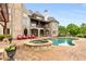 Backyard with sparkling pool, hot tub, patio seating, and lush landscaping creates a private oasis at 2855 Drayton Hall Dr, Buford, GA 30519
