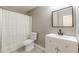 Bathroom featuring modern vanity with black fixtures, a toilet, and a shower with a white curtain at 3022 Stonebridge Creek Dr, Lithonia, GA 30058