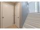 Bright entryway features white stairs and neutral walls, creating a welcoming atmosphere at 3022 Stonebridge Creek Dr, Lithonia, GA 30058