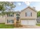 Charming two-story home featuring a two-car garage, inviting entrance, and well-maintained landscaping at 3022 Stonebridge Creek Dr, Lithonia, GA 30058