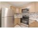 Well-equipped kitchen with stainless steel appliances and stylish cabinetry at 3022 Stonebridge Creek Dr, Lithonia, GA 30058