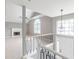 Spacious living room with high ceilings, fireplace, large windows, and modern staircase at 3022 Stonebridge Creek Dr, Lithonia, GA 30058