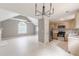 Open living space featuring modern kitchen and living room with light wood flooring at 3022 Stonebridge Creek Dr, Lithonia, GA 30058