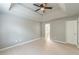 Spacious main bedroom with tray ceiling, light wood flooring, and ensuite access at 3022 Stonebridge Creek Dr, Lithonia, GA 30058