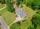 Beautiful aerial view of a well-maintained property with lush landscaping, a long driveway, and a spacious backyard at 47 Centerport Dr, White, GA 30184