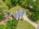Wonderful aerial view of a home featuring a well-manicured lawn, mature trees, and a private backyard with a trampoline at 47 Centerport Dr, White, GA 30184