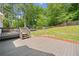 Spacious backyard features large wooden deck and fenced-in yard for recreation at 47 Centerport Dr, White, GA 30184