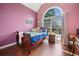 Bedroom with arched window, hardwood floors and nice view at 47 Centerport Dr, White, GA 30184