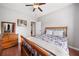 Bedroom featuring hardwood floors, dresser, and window at 47 Centerport Dr, White, GA 30184