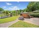 Community playground and picnic area with a well-maintained playset, picnic tables, and lush green surroundings at 47 Centerport Dr, White, GA 30184