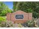 Welcoming brick community sign for North Hampton, surrounded by beautiful landscaping and blooming flowers at 47 Centerport Dr, White, GA 30184