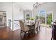 Bright dining room with large windows and hardwood floors at 47 Centerport Dr, White, GA 30184