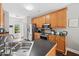 Functional kitchen with stainless steel appliances, hardwood floors, and ample counter space at 47 Centerport Dr, White, GA 30184
