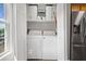 Laundry area with appliances, cabinets and natural light at 47 Centerport Dr, White, GA 30184