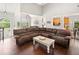 Open-concept living room with hardwood floors and high ceilings at 47 Centerport Dr, White, GA 30184