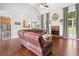 Spacious living room boasts hardwood floors, a brick fireplace, and ample natural light at 47 Centerport Dr, White, GA 30184