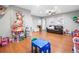 Spacious playroom featuring hardwood floors, a ceiling fan and colorful decor for  at 47 Centerport Dr, White, GA 30184