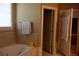 Relaxing bathroom featuring a large soaking tub and neutral tile, perfect for unwinding at 1699 Little Fox Ln, Dacula, GA 30019