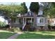 Charming two-story home with a brick stairway, landscaped front yard, and inviting front porch at 1699 Little Fox Ln, Dacula, GA 30019