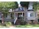 Charming two-story home with a brick stairway, landscaped front yard, and inviting front porch at 1699 Little Fox Ln, Dacula, GA 30019