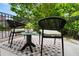 Cozy outdoor seating area with a table and chairs on a private balcony at 190 Centennial Way, Atlanta, GA 30313