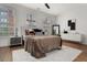 Bright bedroom featuring large windows, a ceiling fan, and stylish decor with comfortable sleeping arrangements at 190 Centennial Way, Atlanta, GA 30313