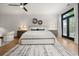 A bedroom featuring a ceiling fan, wood floors, and natural light from the sliding door at 190 Centennial Way, Atlanta, GA 30313