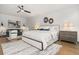 Beautiful bedroom featuring a ceiling fan, wood floors, and contemporary decor at 190 Centennial Way, Atlanta, GA 30313