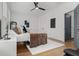 Comfortable bedroom featuring large windows, ceiling fan, and stylish decor with comfortable sleeping arrangements at 190 Centennial Way, Atlanta, GA 30313
