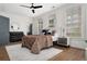 Bright bedroom featuring large windows, ceiling fan, and stylish decor with comfortable sleeping arrangements at 190 Centennial Way, Atlanta, GA 30313