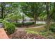 Scenic view of the community pool area surrounded by lush landscaping and greenery at 190 Centennial Way, Atlanta, GA 30313