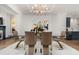 Bright dining room with modern chandelier, seating for six, and elegant decor at 190 Centennial Way, Atlanta, GA 30313