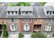 A well-maintained multi-story townhome building with brick facade and dormer windows at 190 Centennial Way, Atlanta, GA 30313