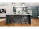 Modern kitchen with stainless steel appliances and stylish counter seating at 190 Centennial Way, Atlanta, GA 30313