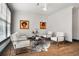 Bright living room featuring modern decor, hardwood floors, and four stylish chairs at 190 Centennial Way, Atlanta, GA 30313