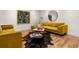 This spacious living room features hardwood floors, contemporary furniture and decor, and modern lighting at 190 Centennial Way, Atlanta, GA 30313