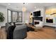 Beautiful living room showcasing a fireplace, large windows, and modern decor at 190 Centennial Way, Atlanta, GA 30313