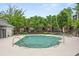 A large community pool with lounge chairs surrounded by green landscaping and trees at 190 Centennial Way, Atlanta, GA 30313