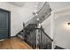 Stylish staircase featuring dark railing, wood treads, and modern lighting at 190 Centennial Way, Atlanta, GA 30313