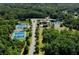 Aerial view of tennis courts, clubhouse, and surrounding lush greenery at 34 Mountainbrook Nw Dr, Cartersville, GA 30121
