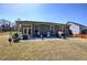 Well-maintained backyard featuring a patio with seating area, ideal for outdoor entertaining at 34 Mountainbrook Nw Dr, Cartersville, GA 30121