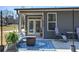 Back patio with outdoor seating, rug, and fire pit perfect for relaxing and entertaining at 34 Mountainbrook Nw Dr, Cartersville, GA 30121