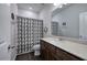 Neutral bathroom features a dark vanity and a patterned shower curtain at 34 Mountainbrook Nw Dr, Cartersville, GA 30121