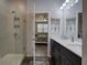 Tastefully designed bathroom with shower, vanity, and access to bedroom at 34 Mountainbrook Nw Dr, Cartersville, GA 30121
