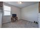 Bedroom features a rustic desk, TV, and neutral carpeting at 34 Mountainbrook Nw Dr, Cartersville, GA 30121