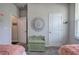 Bedroom features a decorative wall hanging, a green bench, and neutral carpet at 34 Mountainbrook Nw Dr, Cartersville, GA 30121