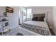 Neutral bedroom features patterned bedding, neutral walls, white trim, carpet, and natural light at 34 Mountainbrook Nw Dr, Cartersville, GA 30121