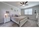 Bright bedroom with a large window, ceiling fan, and stylish furnishings at 34 Mountainbrook Nw Dr, Cartersville, GA 30121