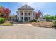 Stately clubhouse with white columns and well-maintained landscaping at 34 Mountainbrook Nw Dr, Cartersville, GA 30121