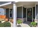 Charming front porch with seating, stylish decor, and a welcoming entrance at 34 Mountainbrook Nw Dr, Cartersville, GA 30121